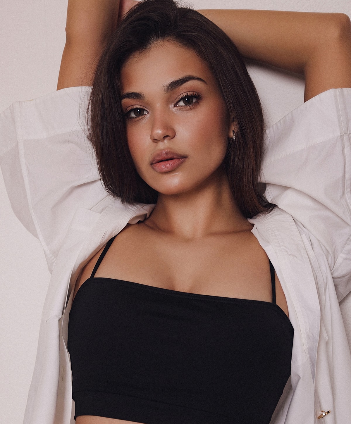 Model poses in a stylish black swimsuit.