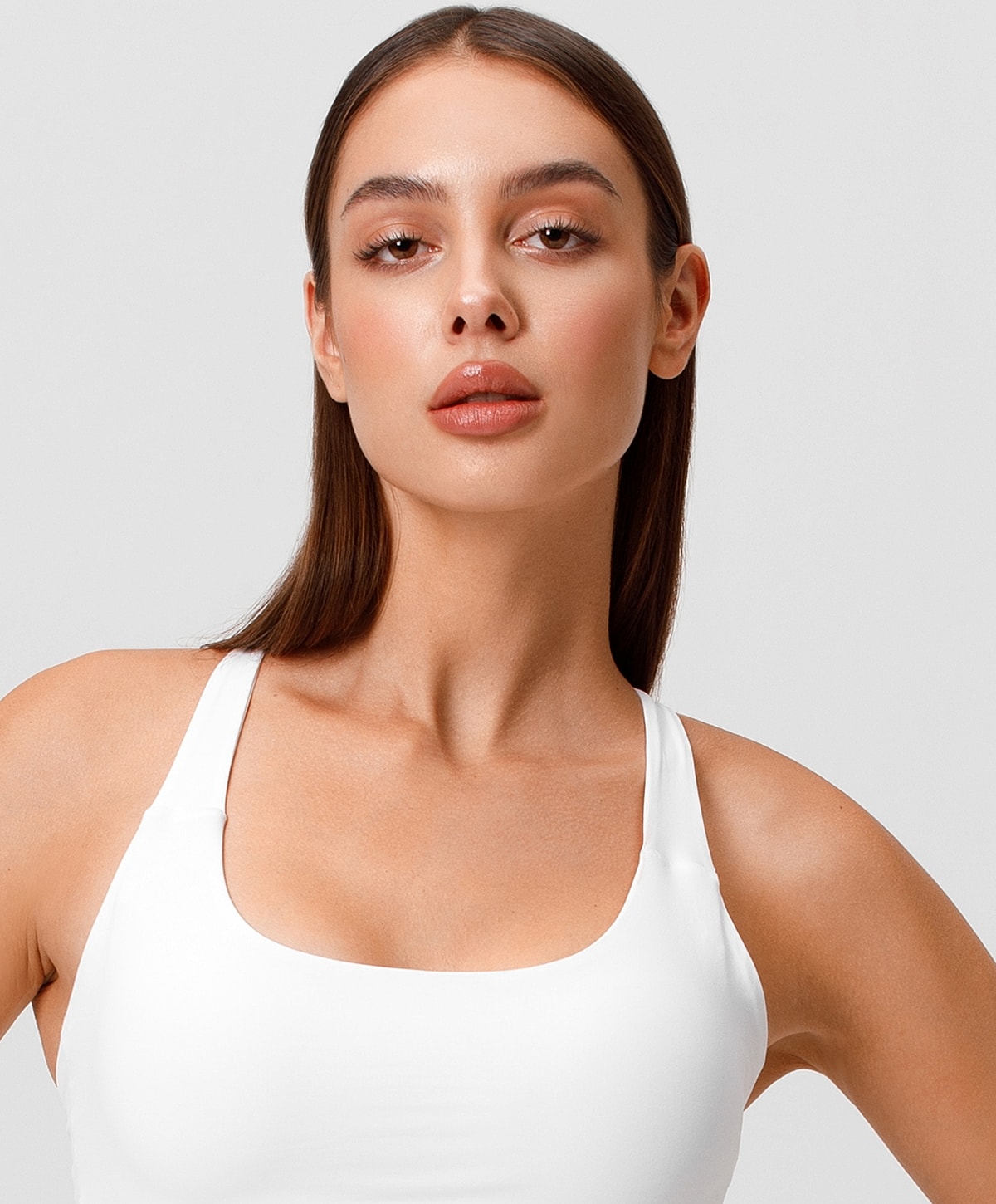 Model in stylish black outfit posing confidently.