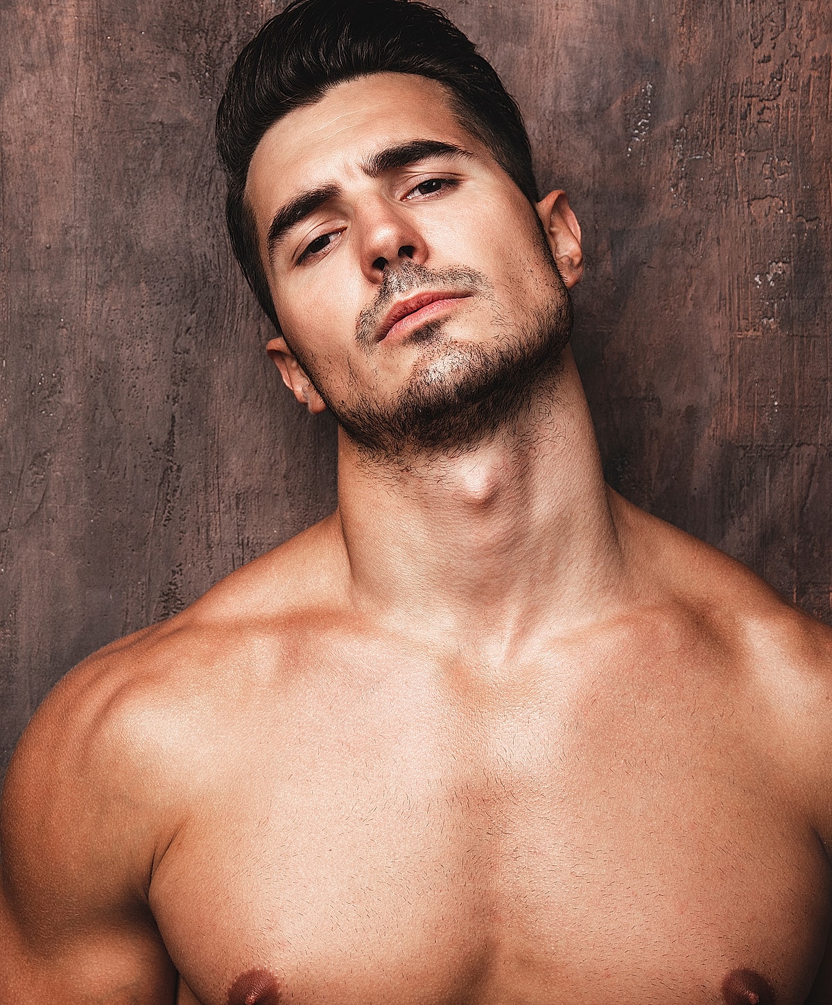 Woman in black athletic wear posing elegantly.