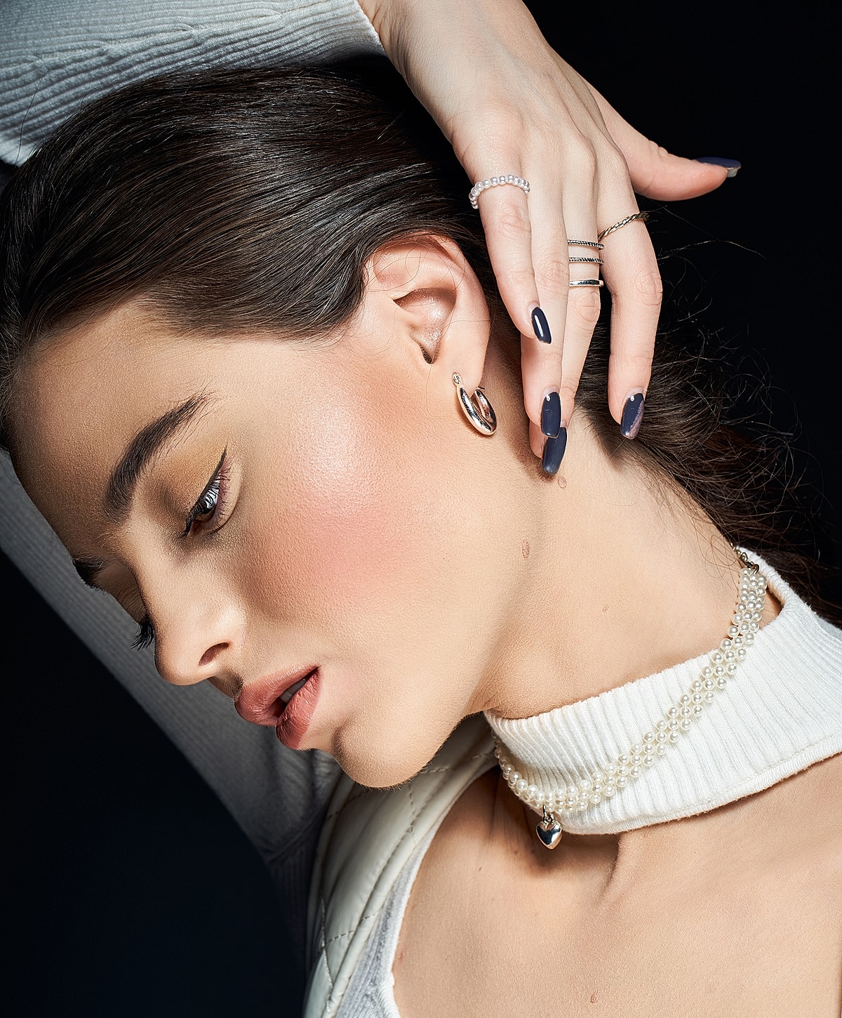 Model poses in a stylish black swimsuit.