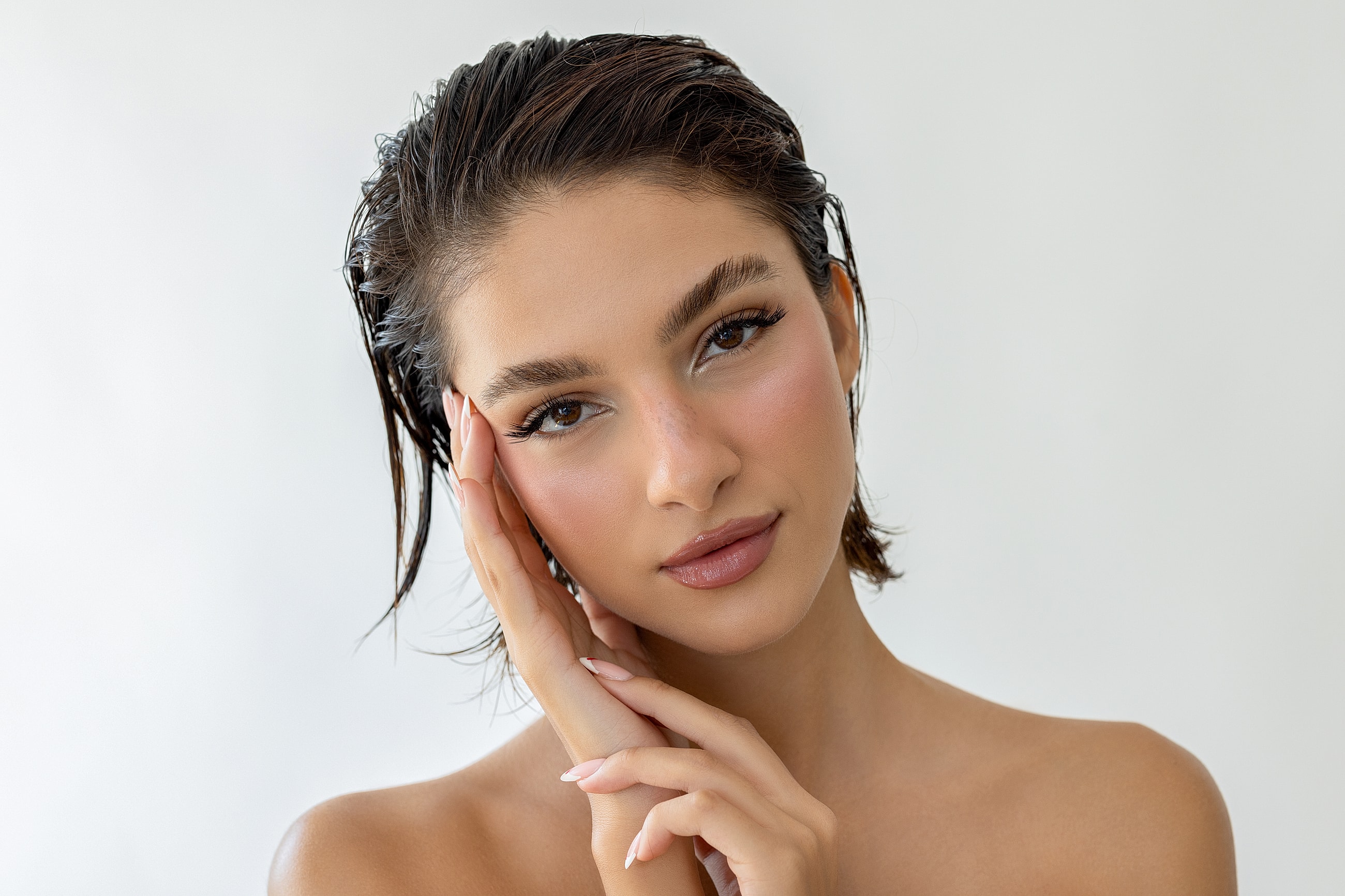 Woman with long dark hair and soft expression.
