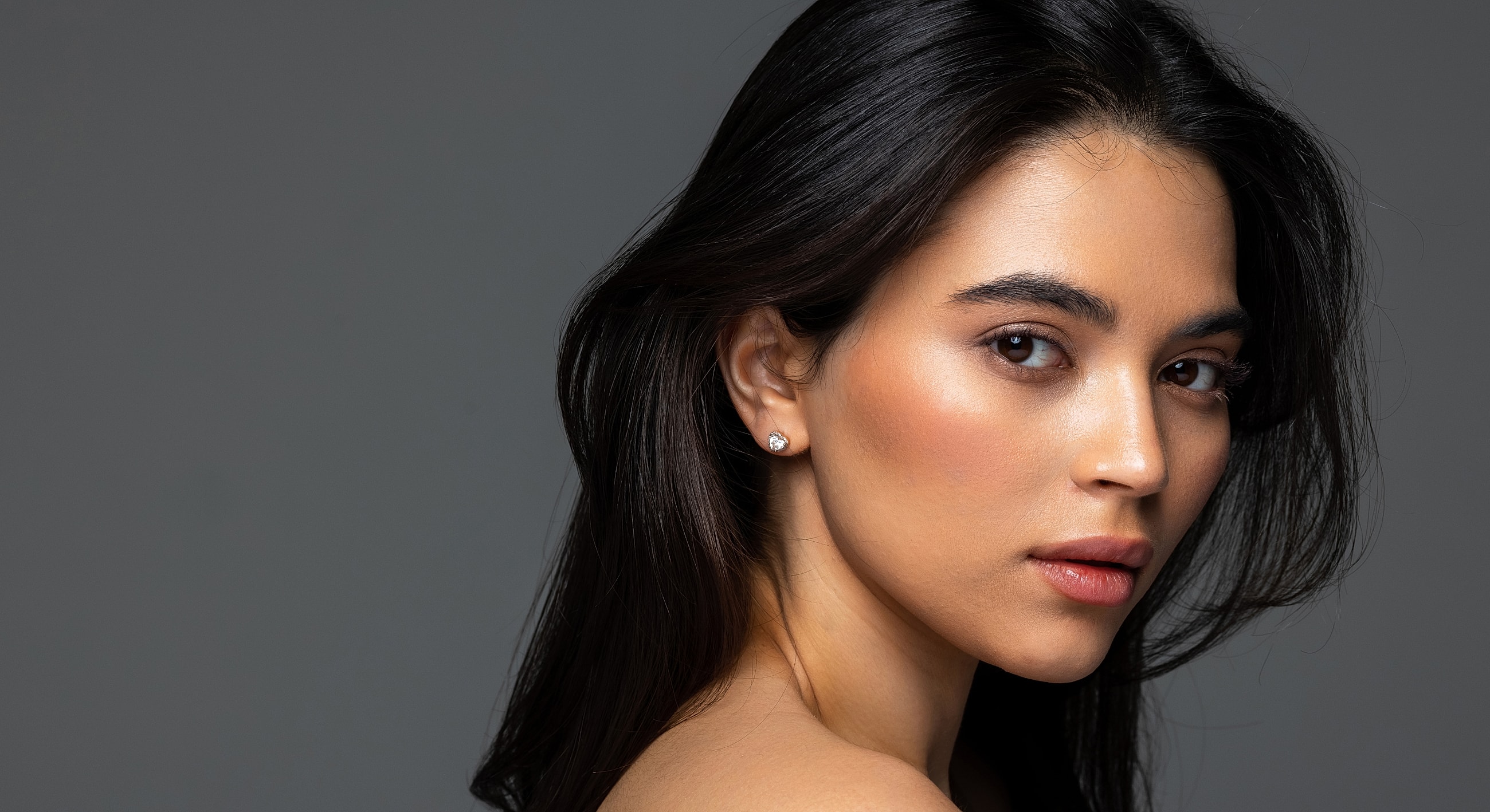 Portrait of a young woman with long hair.